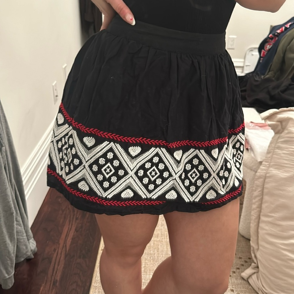Mini black skirt with embroidery